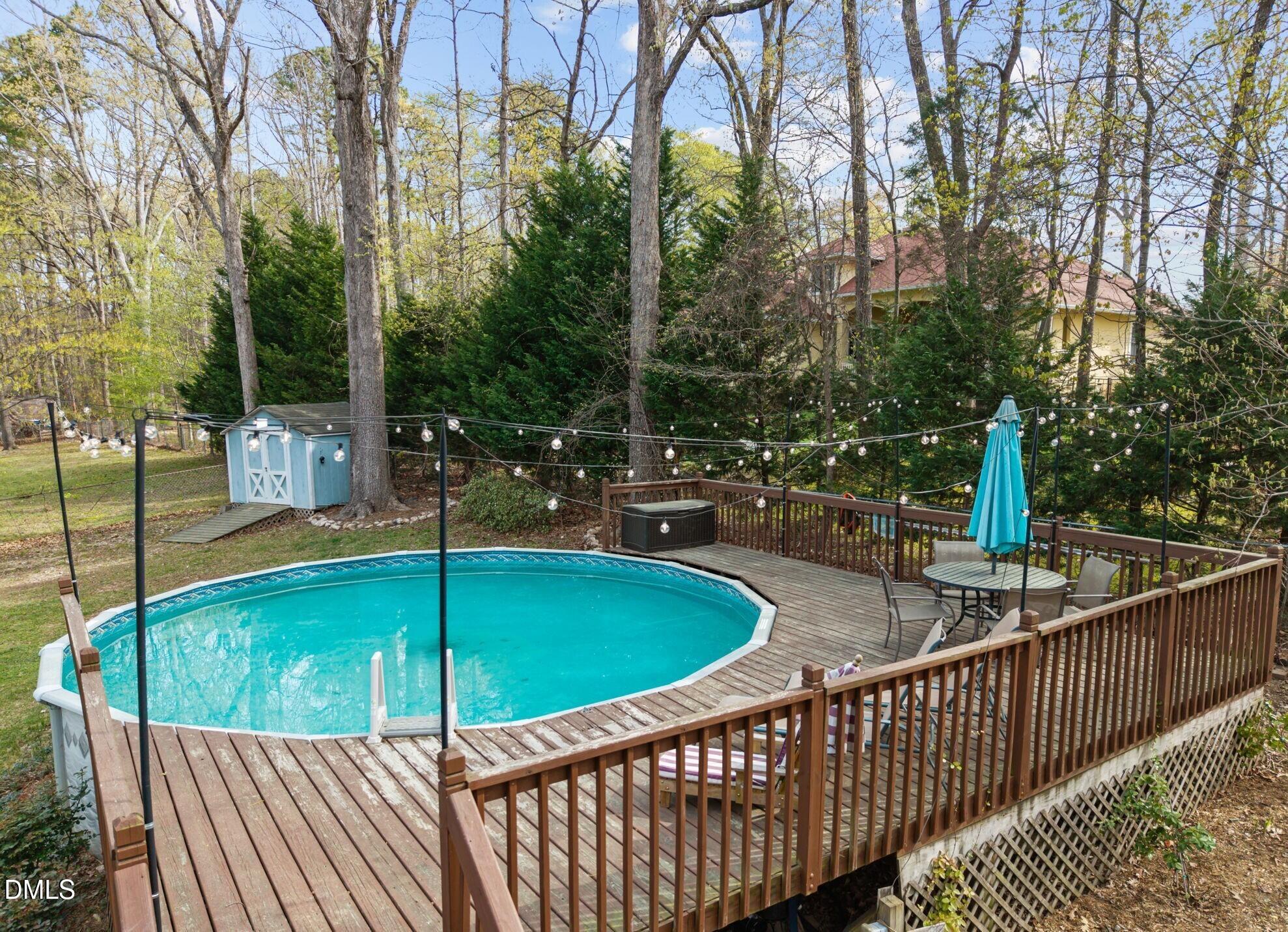 212 Esquire Lane Cary, NC 27513 - Photo 23 of 31 a view of a swimming pool with a patio