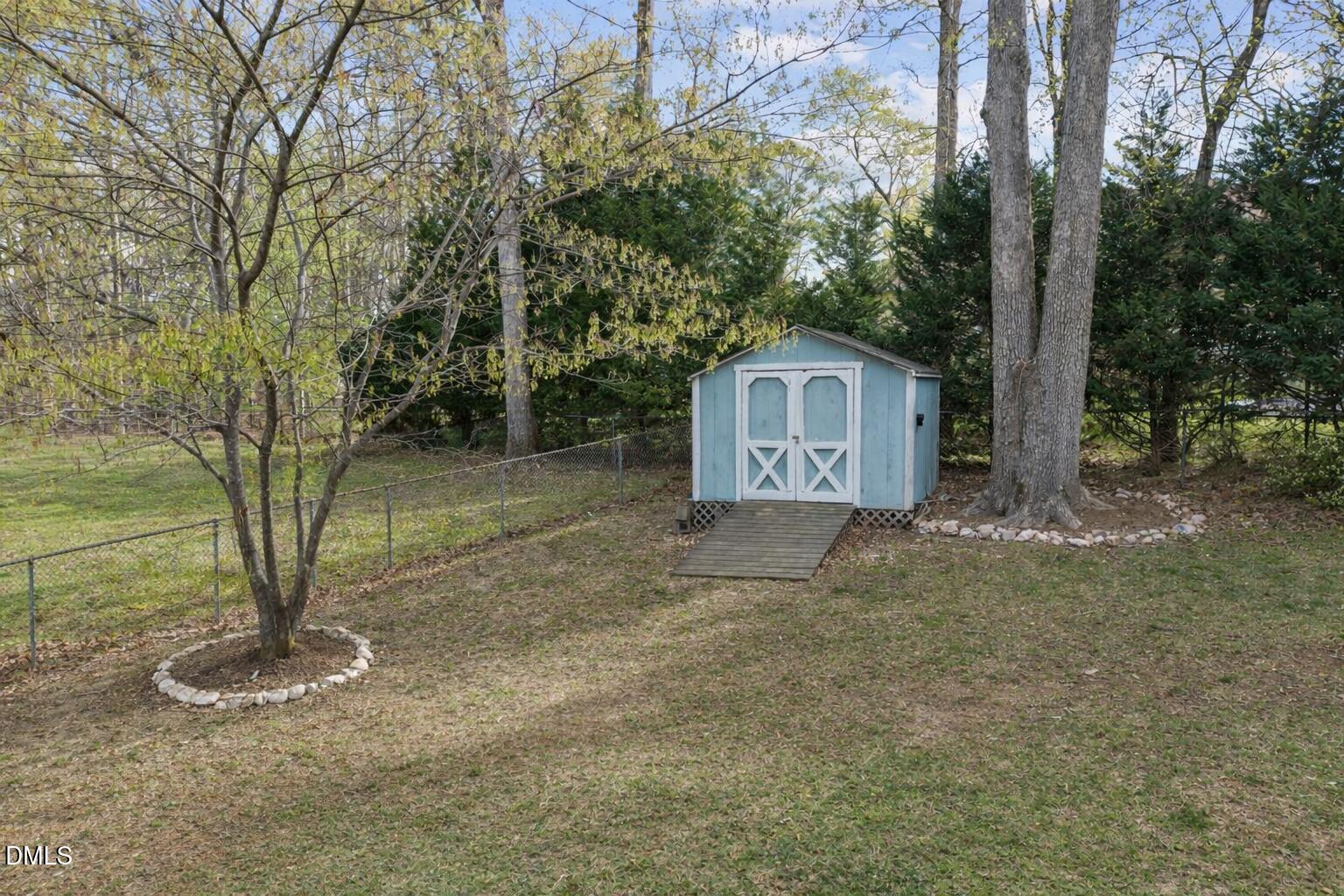 212 Esquire Lane Cary, NC 27513 - Photo 26 of 31 a view of a small house with a tree