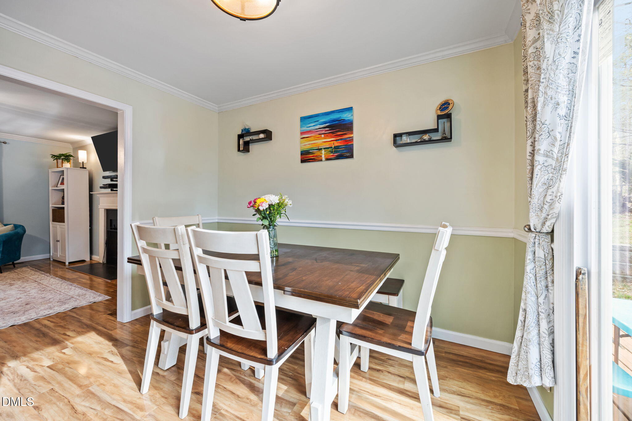 212 Esquire Lane Cary, NC 27513 - Photo 4 of 31 a view of a dining room with furniture and wooden floor