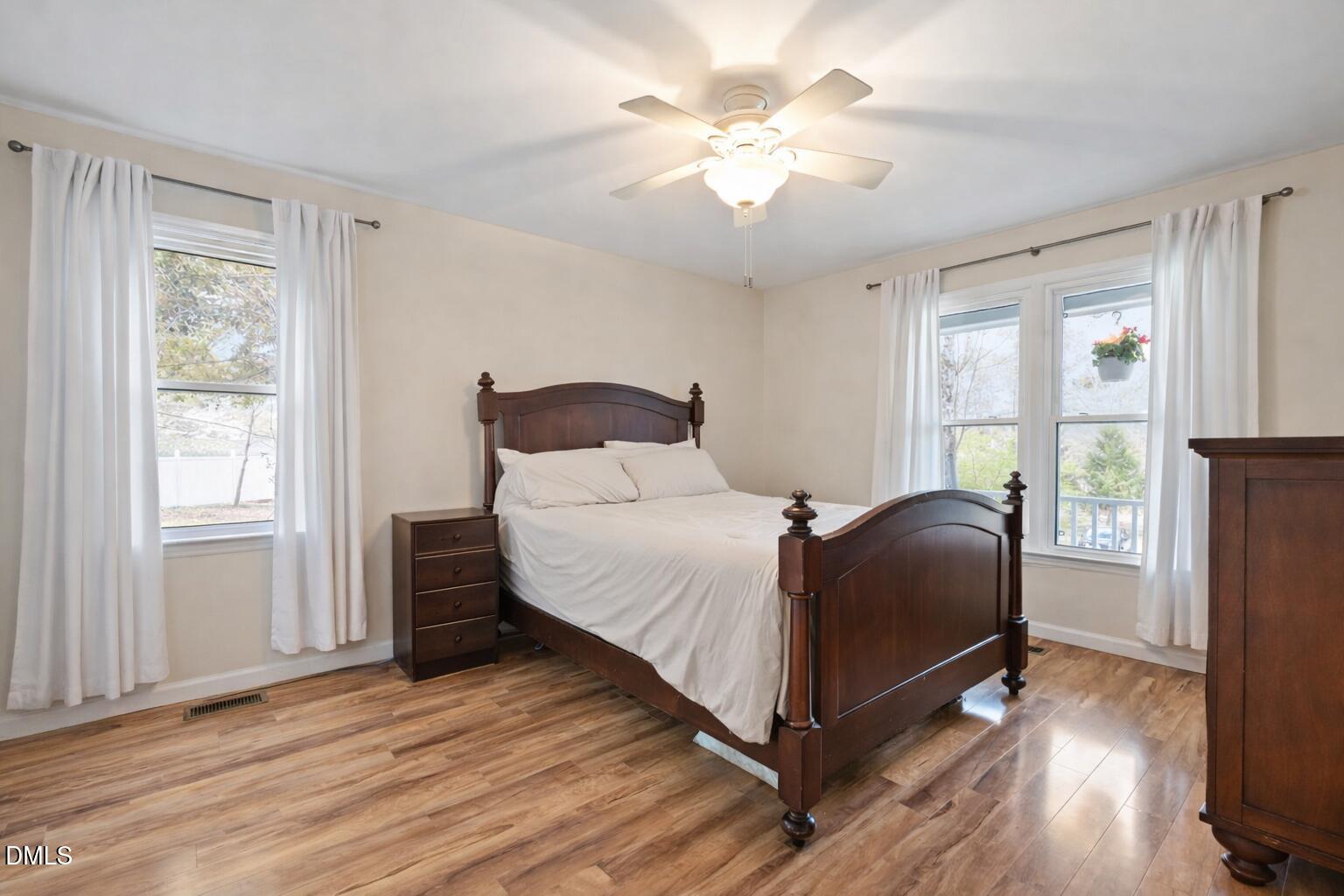 212 Esquire Lane Cary, NC 27513 - Photo 10 of 31 a bedroom with a bed and a window