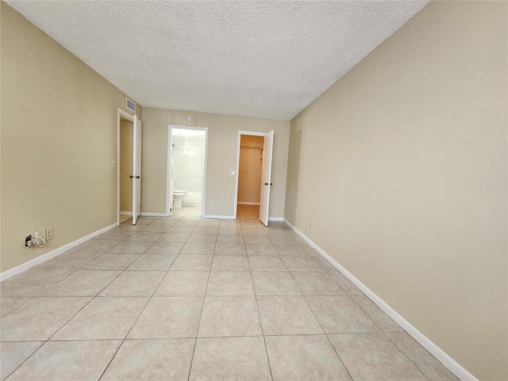545 Trace Circle, Unit 105 Deerfield Beach, FL 33441 - Photo 17 of 44 a view of an empty room and window
