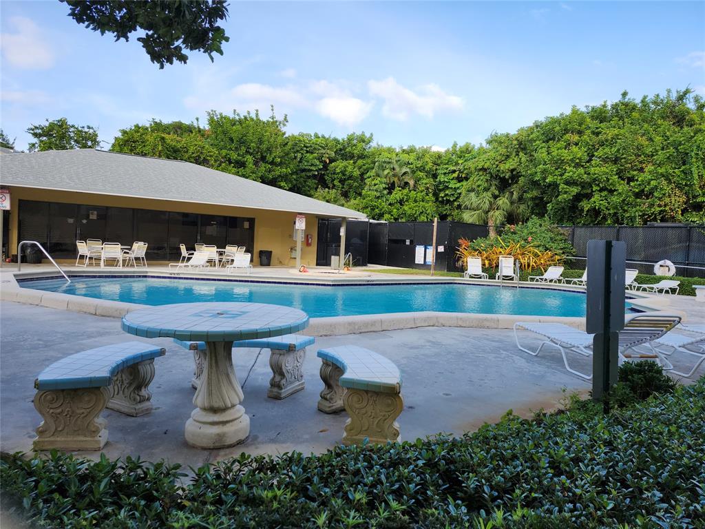 545 Trace Circle, Unit 105 Deerfield Beach, FL 33441 - Photo 2 of 44 a view of a house with outdoor space