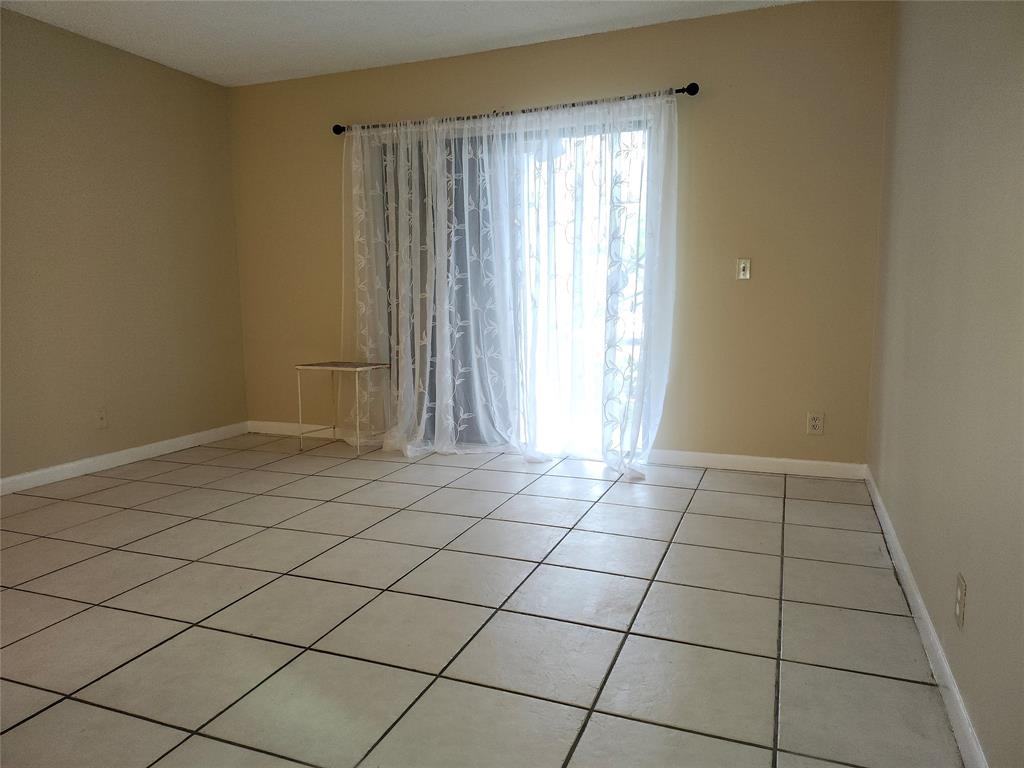 545 Trace Circle, Unit 105 Deerfield Beach, FL 33441 - Photo 22 of 44 a view of an empty room and window