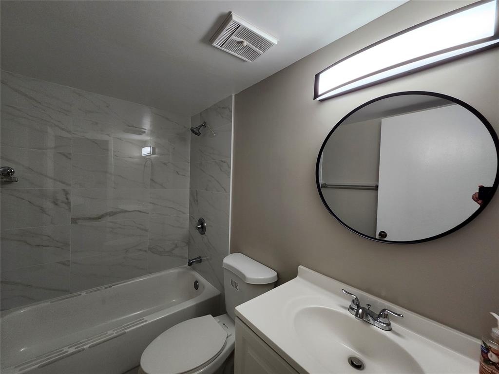 545 Trace Circle, Unit 105 Deerfield Beach, FL 33441 - Photo 28 of 44 a bathroom with a sink toilet and shower