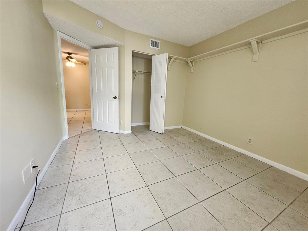 545 Trace Circle, Unit 105 Deerfield Beach, FL 33441 - Photo 36 of 44 a view of an empty room