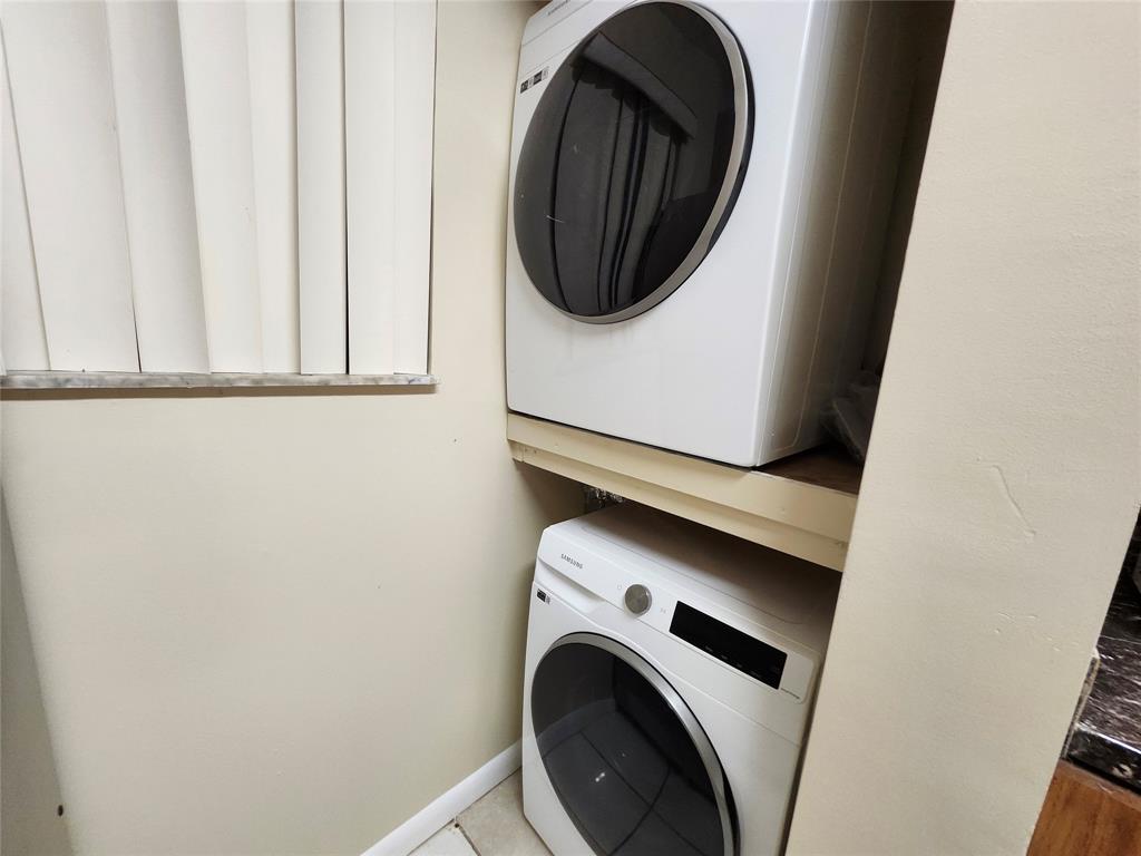 545 Trace Circle, Unit 105 Deerfield Beach, FL 33441 - Photo 43 of 44 a close up view of a washer and dryer