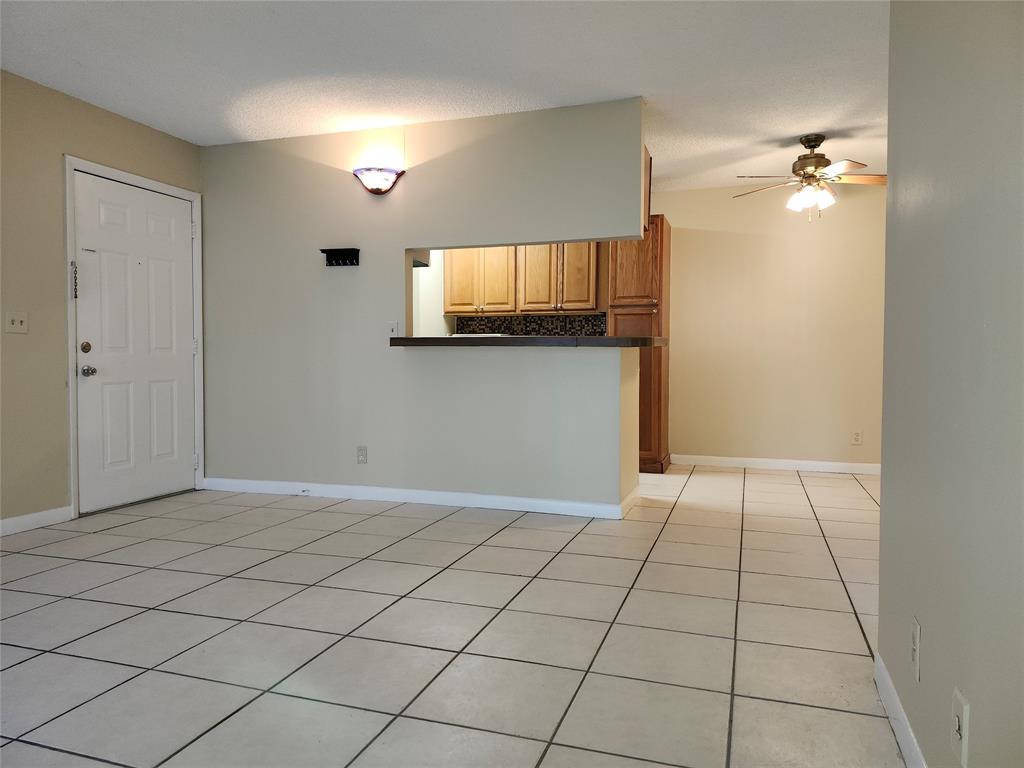 545 Trace Circle, Unit 105 Deerfield Beach, FL 33441 - Photo 5 of 44 a view of an empty room with a window