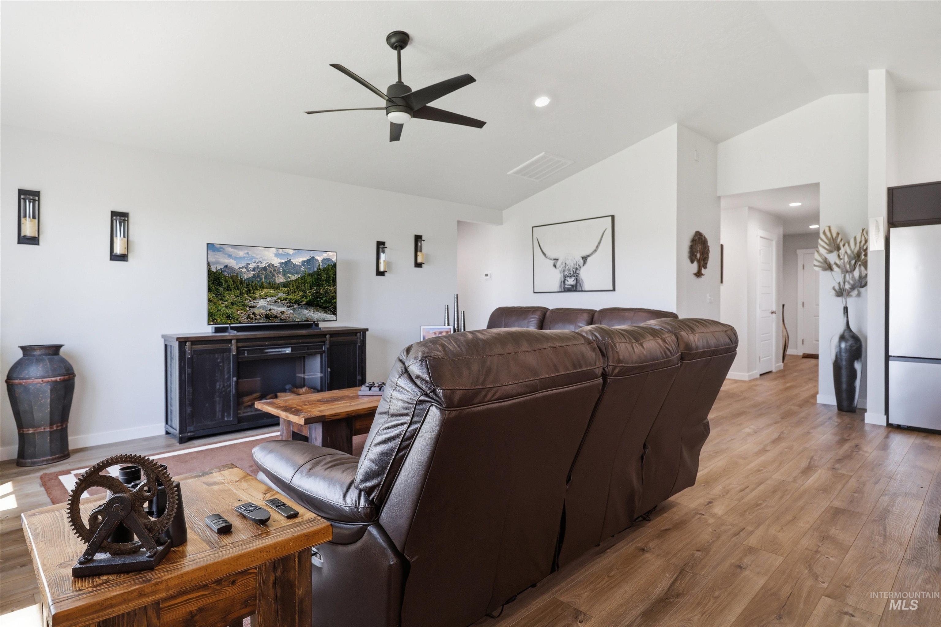 3811 West Maypearl Street Meridian, ID 83642 - Photo 15 of 39 Spacious living area featuring wood-finish flooring, vaulted ceilings, and recessed lighting