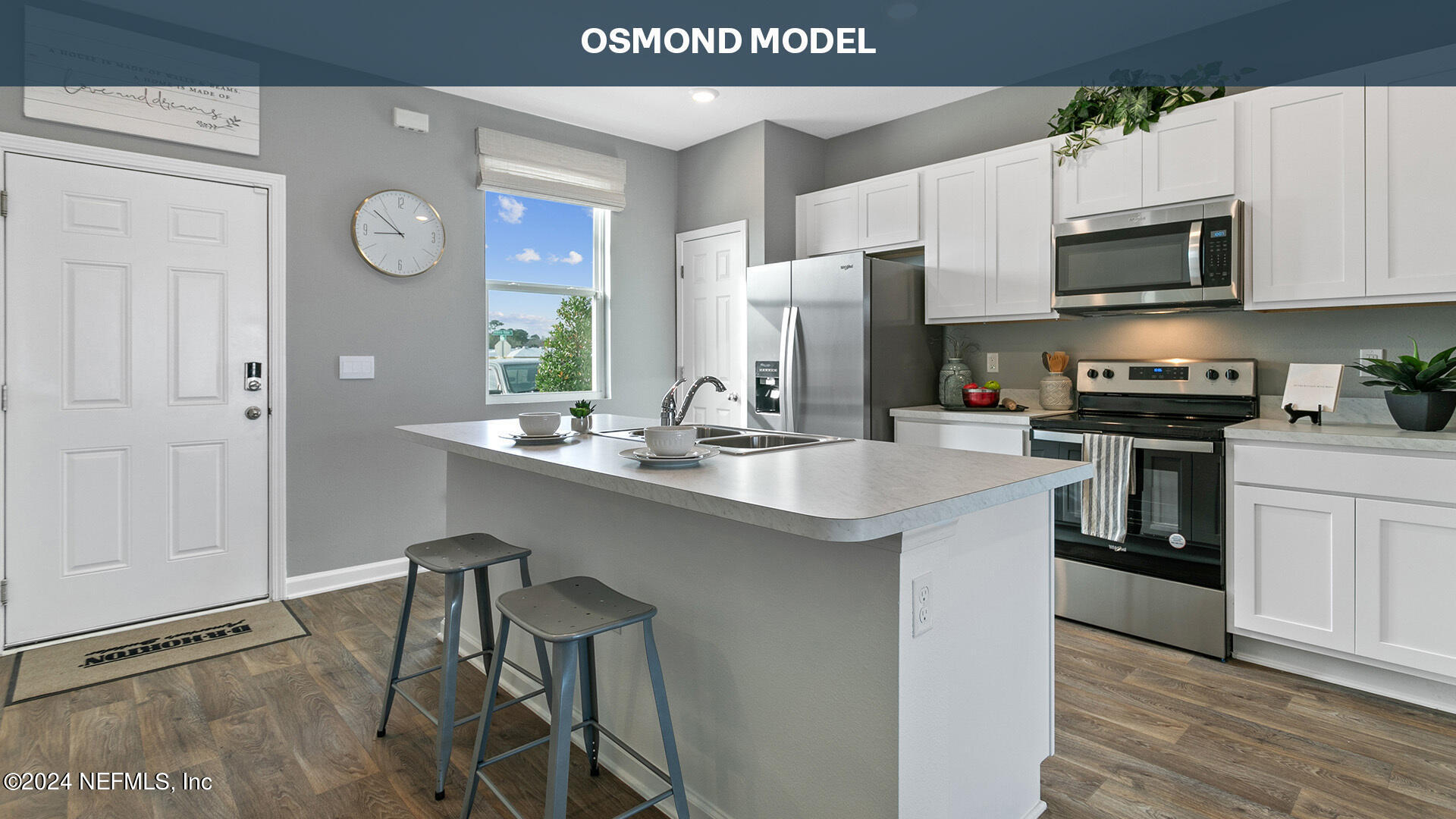 a kitchen with stainless steel appliances granite countertop a refrigerator a stove top oven a sink and dishwasher