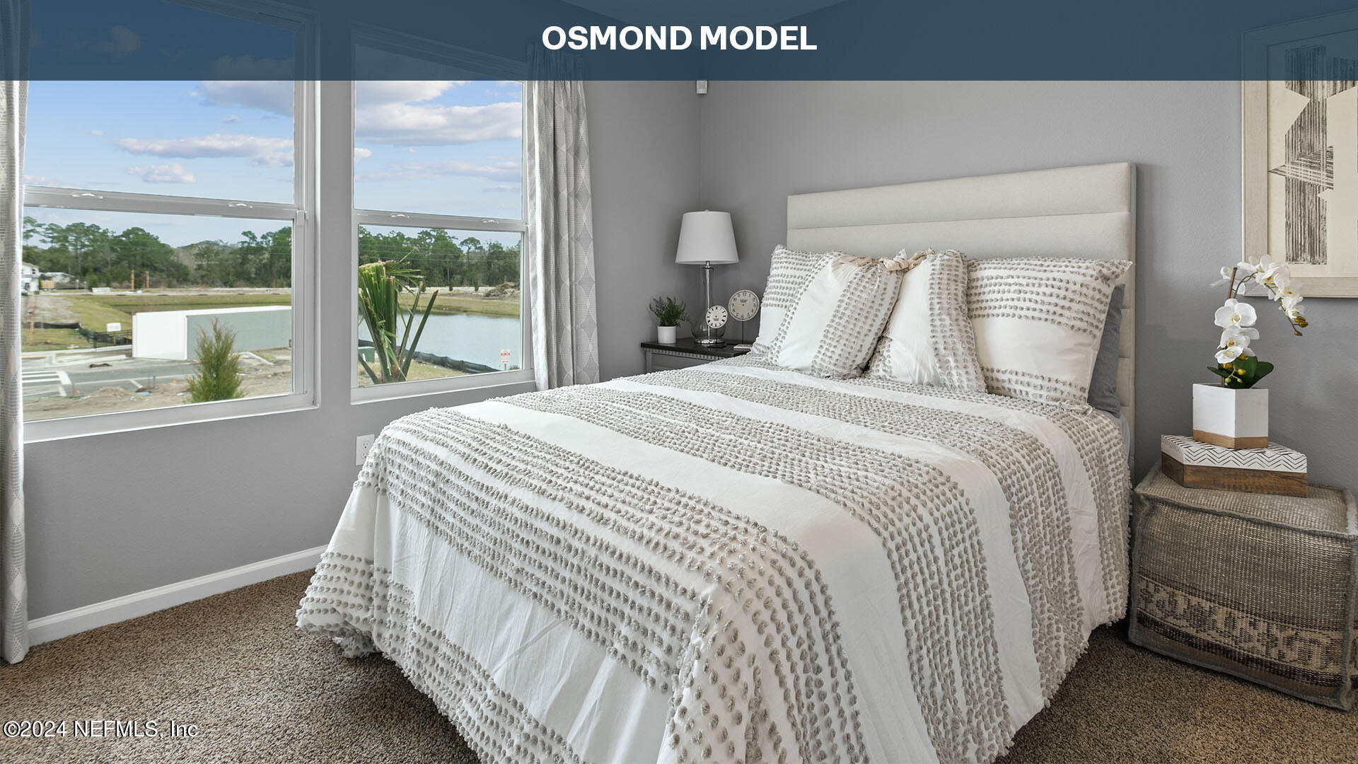 196 Stonegate Avenue St. Augustine, FL 32084 - Photo 13 of 32 a bedroom with a bed and a large window