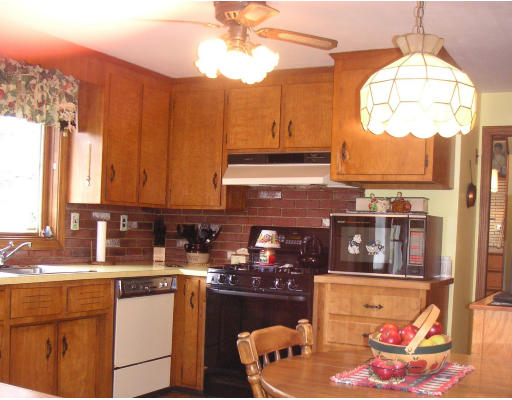 4 Richard Road Canton, MA 02021 - Photo 4 of 8 a kitchen with stainless steel appliances granite countertop a stove a sink and a dining table