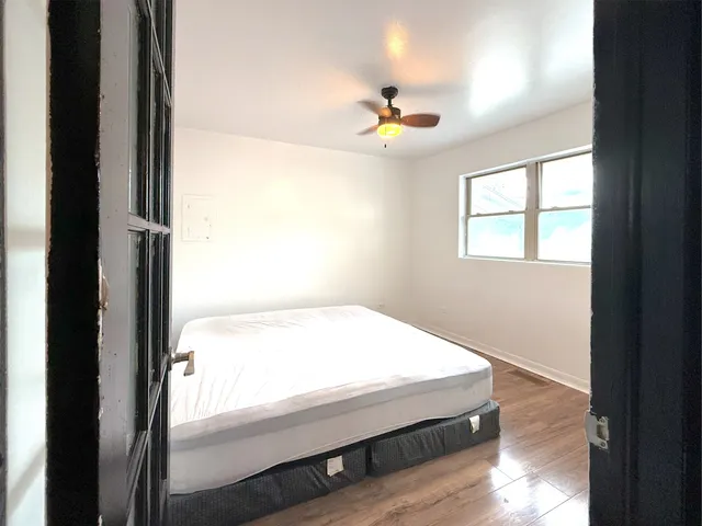 a bathroom with a bathtub and a window