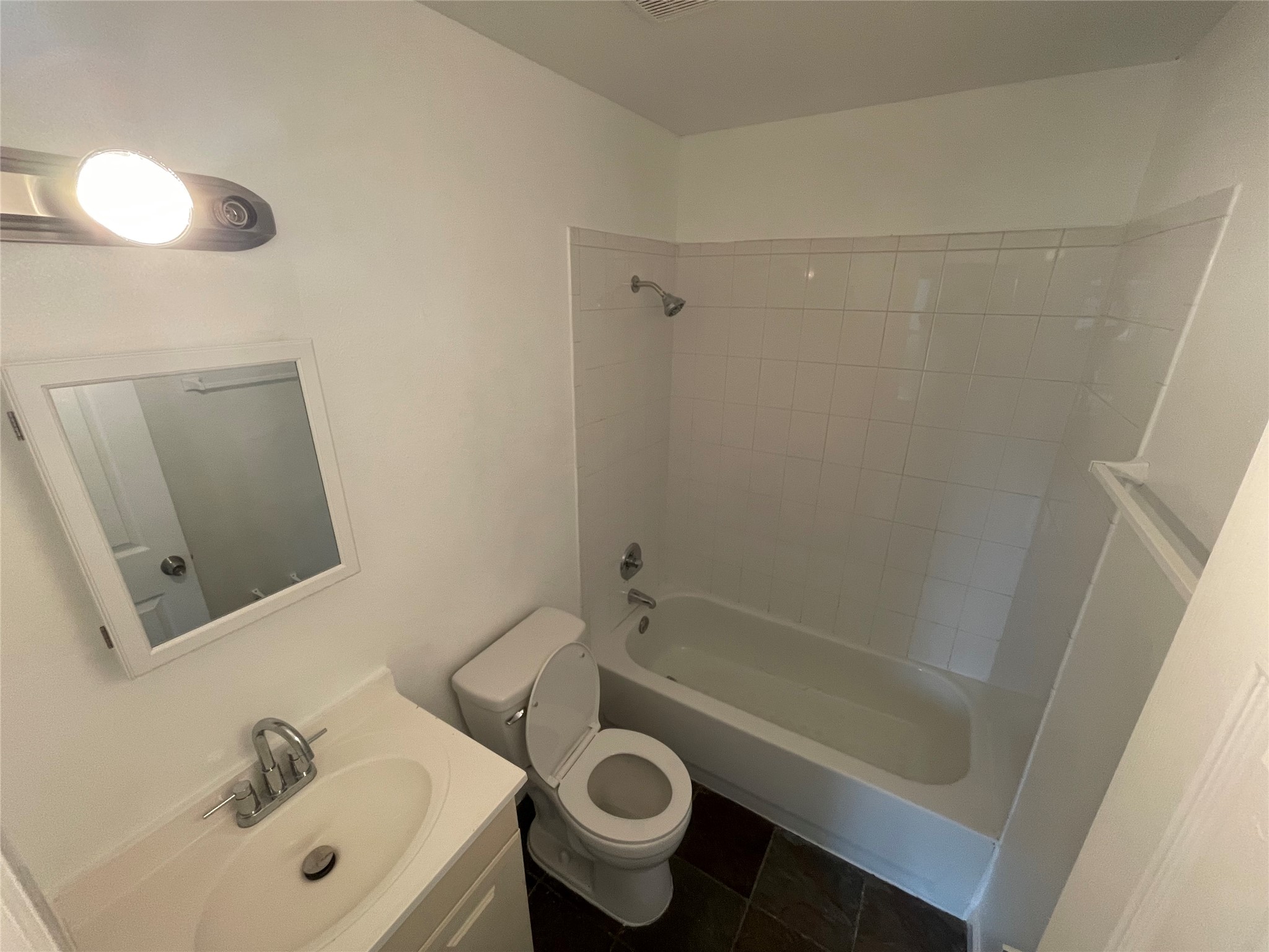 2808 Lyons Road, Unit A Austin, TX 78702 - Photo 3 of 12 a bathroom with a sink a toilet and shower