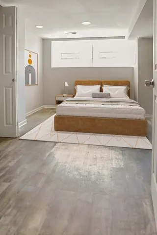 a bedroom with a bed and window