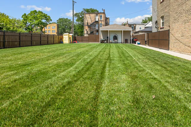 a view of a house with a back yard