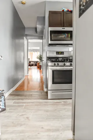 a kitchen with a stove and a microwave