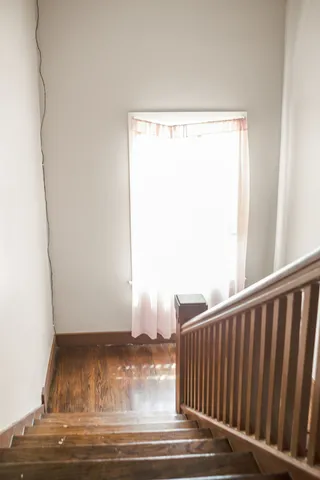 a view of a door with wooden floor