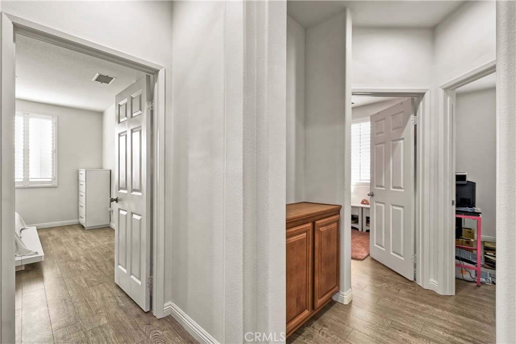 3894 Polk Street, Unit E Riverside, CA 92505 - Photo 13 of 28 wooden floor with a wardrobe space