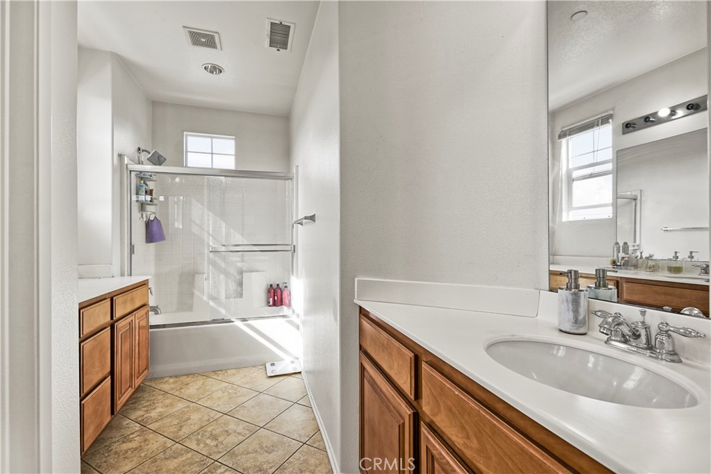 3894 Polk Street, Unit E Riverside, CA 92505 - Photo 15 of 28 a bathroom with a sink a toilet and shower