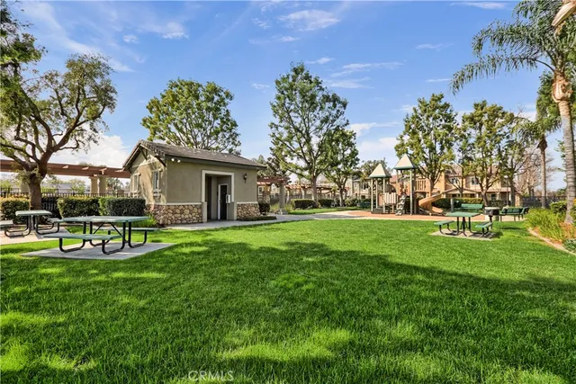 a view of a house with a backyard porch and sitting area