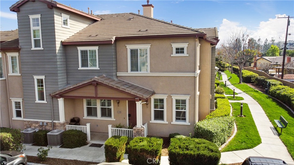 3894 Polk Street, Unit E Riverside, CA 92505 - Photo 27 of 28 a front view of a house with a yard