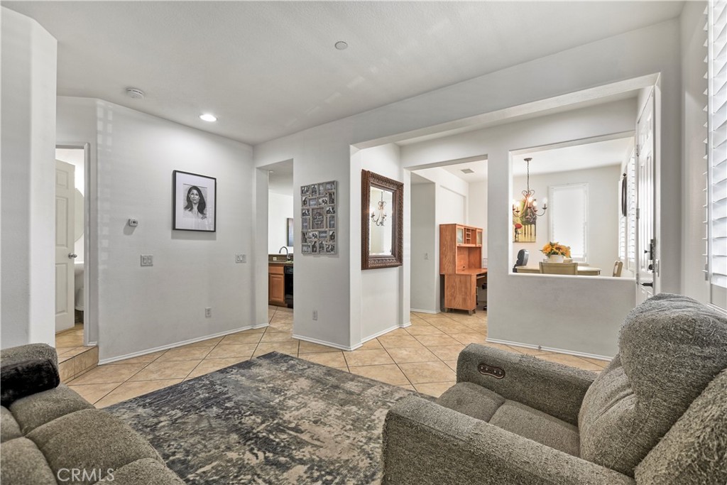 3894 Polk Street, Unit E Riverside, CA 92505 - Photo 5 of 28 a living room with furniture and a rug