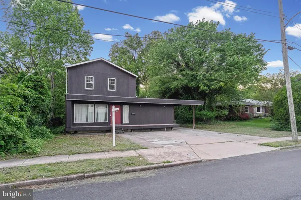 a house on the side of a road