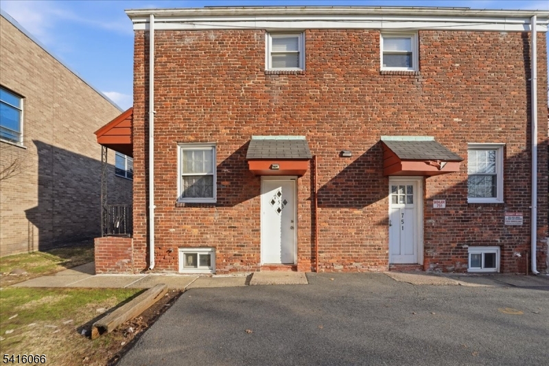 753 Broad Avenue, Unit A Ridgefield, NJ 07657 - Photo 2 of 23 a front view of a building with a road