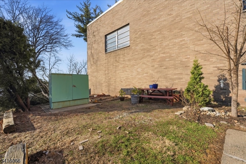 753 Broad Avenue, Unit A Ridgefield, NJ 07657 - Photo 21 of 23 a view of a backyard with a car parked in the patio