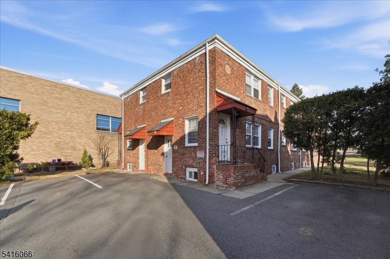 753 Broad Avenue, Unit A Ridgefield, NJ 07657 - Photo 4 of 23 a front view of a house with a yard
