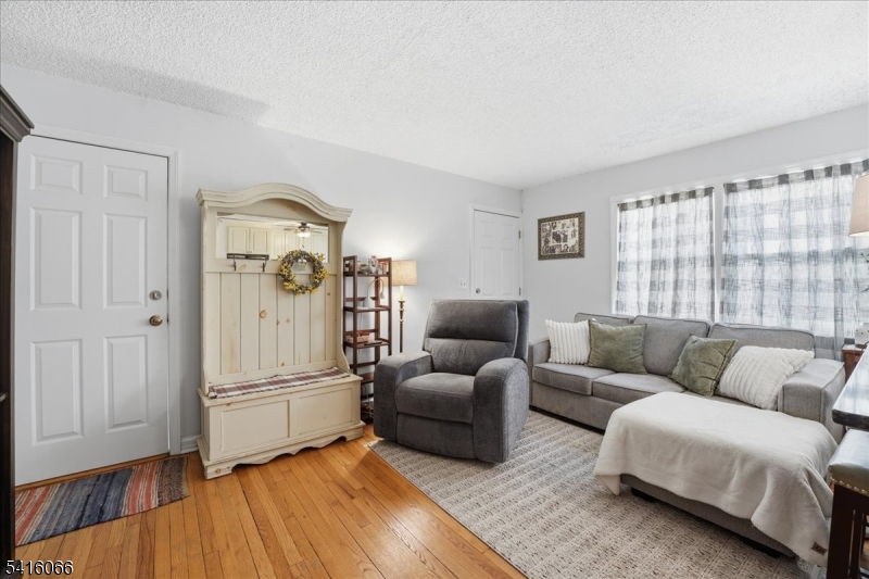 753 Broad Avenue, Unit A Ridgefield, NJ 07657 - Photo 5 of 23 a living room with furniture and a wooden floor
