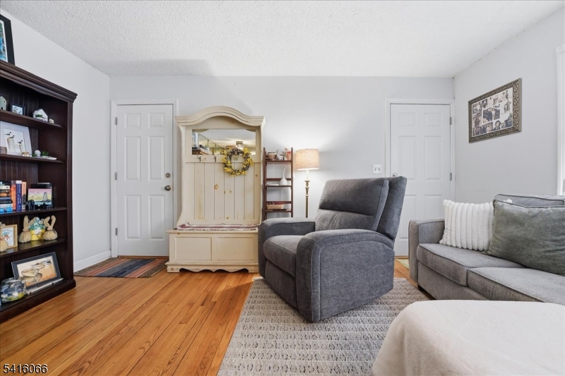 753 Broad Avenue, Unit A Ridgefield, NJ 07657 - Photo 6 of 23 a living room with furniture and a fireplace