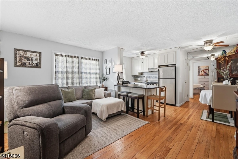 753 Broad Avenue, Unit A Ridgefield, NJ 07657 - Photo 7 of 23 a living room with furniture and a wooden floor