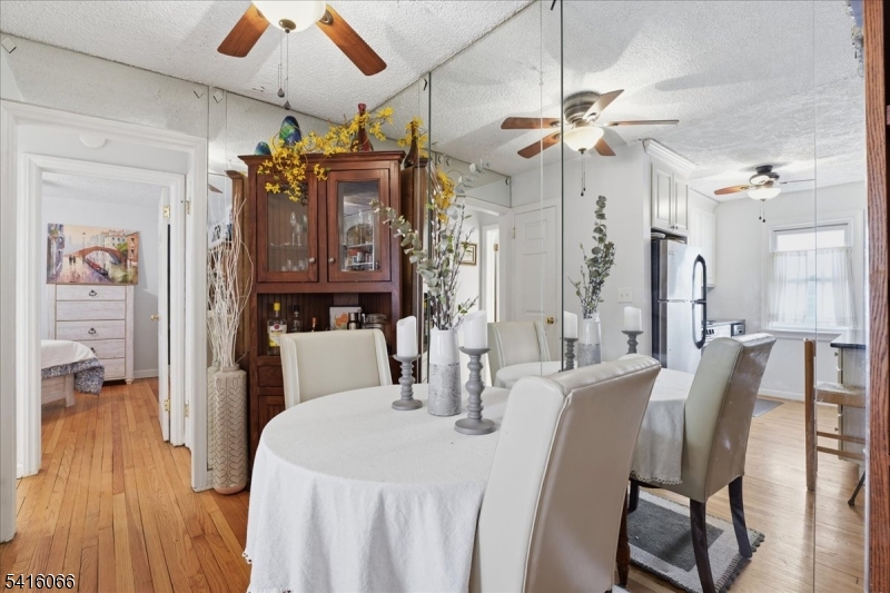 753 Broad Avenue, Unit A Ridgefield, NJ 07657 - Photo 8 of 23 a view of a dining room with furniture and wooden floor