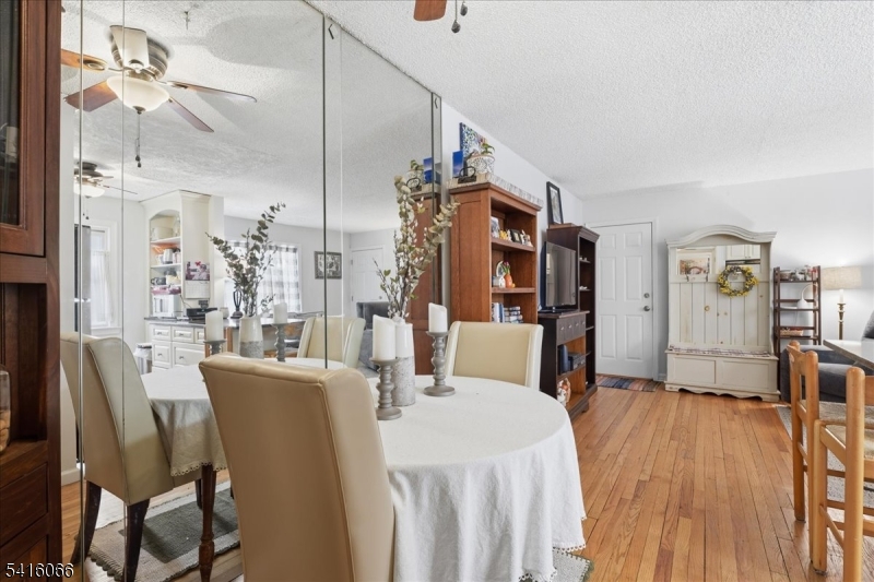 753 Broad Avenue, Unit A Ridgefield, NJ 07657 - Photo 9 of 23 a view of a dining room with furniture and wooden floor