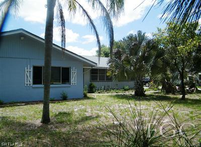 11561 Shawnee Road Fort Myers, FL 33913 - Photo 1 of 10 a view of a house with backyard and sitting area