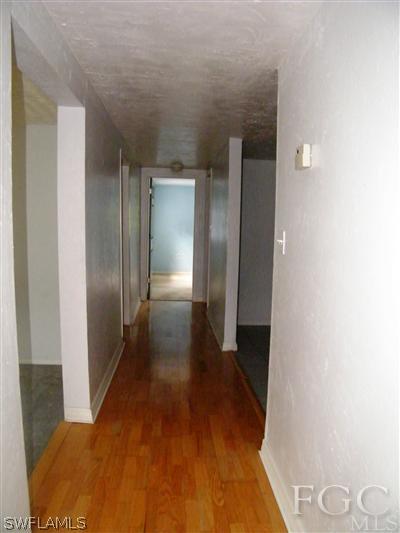 11561 Shawnee Road Fort Myers, FL 33913 - Photo 4 of 10 a view of a hallway