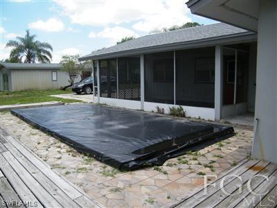 11561 Shawnee Road Fort Myers, FL 33913 - Photo 5 of 10 a view of a house with a yard