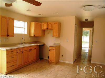 11561 Shawnee Road Fort Myers, FL 33913 - Photo 7 of 10 a bathroom with a sink a mirror and a shower