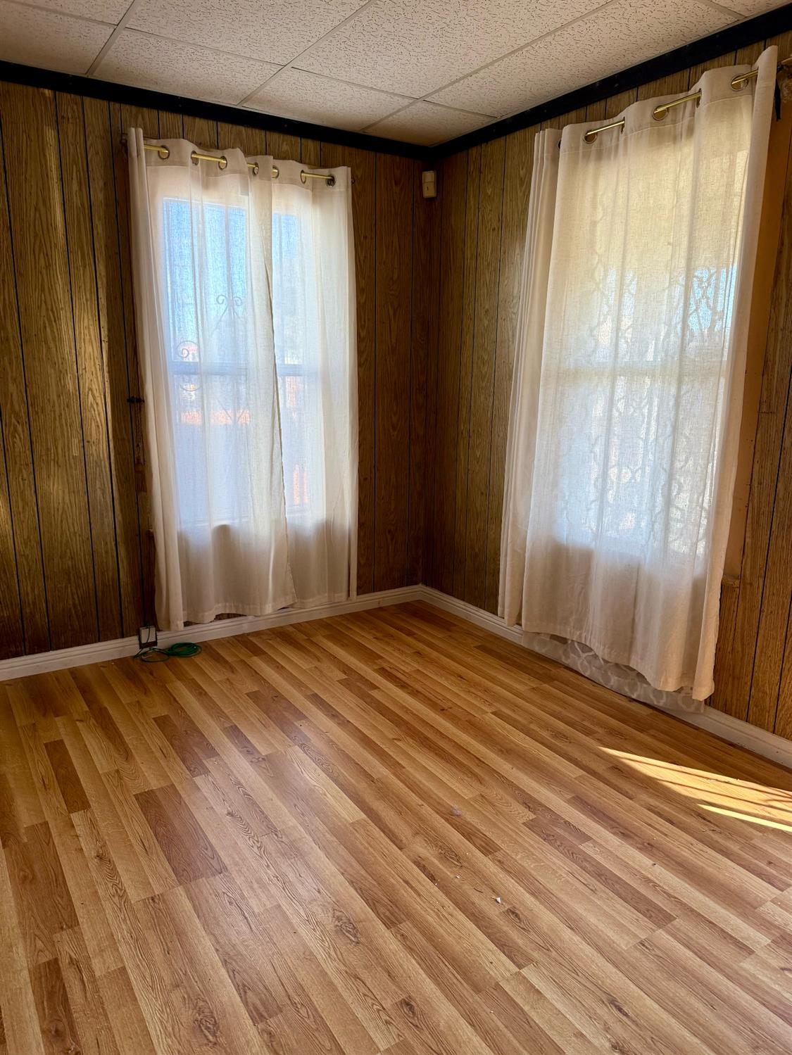 641 9th Street Richmond, CA 94801 - Photo 4 of 14 a view of empty room with wooden floor and fan