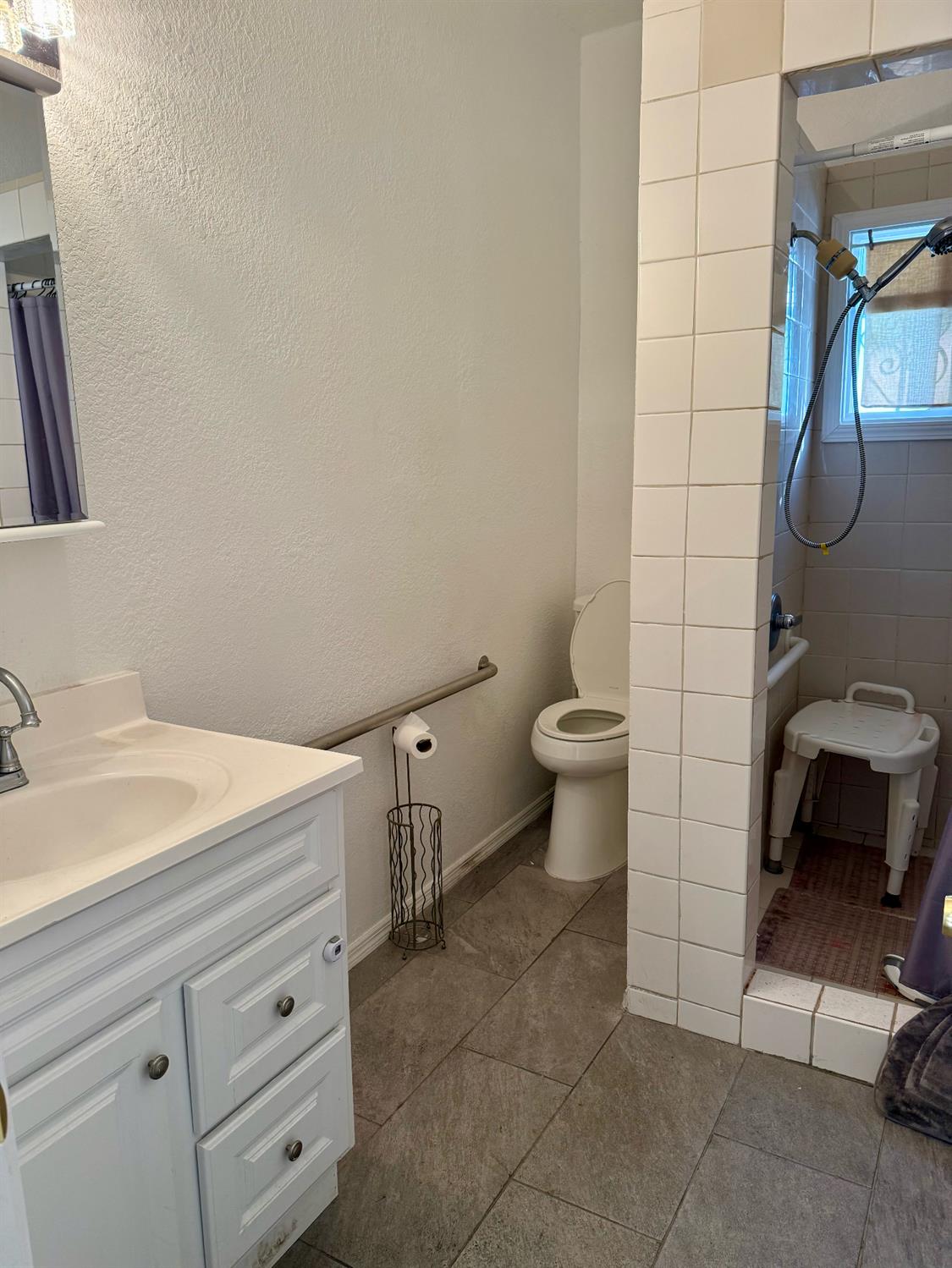 641 9th Street Richmond, CA 94801 - Photo 8 of 14 a bathroom with a toilet and a sink