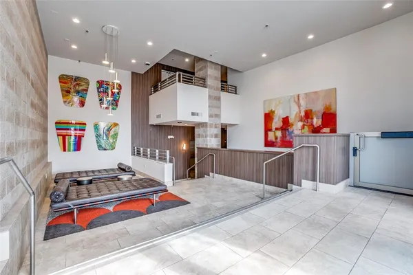 a living room with kitchen island furniture and a appliances