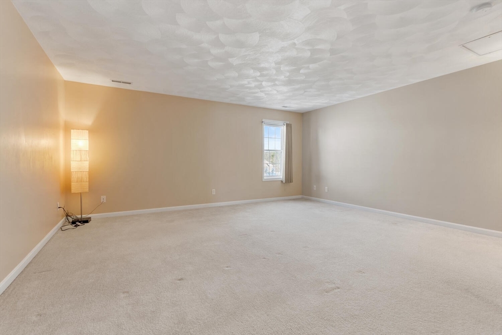 18 Dale Street, Unit 9D Andover, MA 01810 - Photo 21 of 33 an empty room with windows