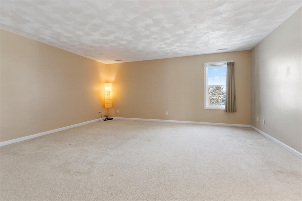 18 Dale Street, Unit 9D Andover, MA 01810 - Photo 22 of 33 a view of an empty room with a window
