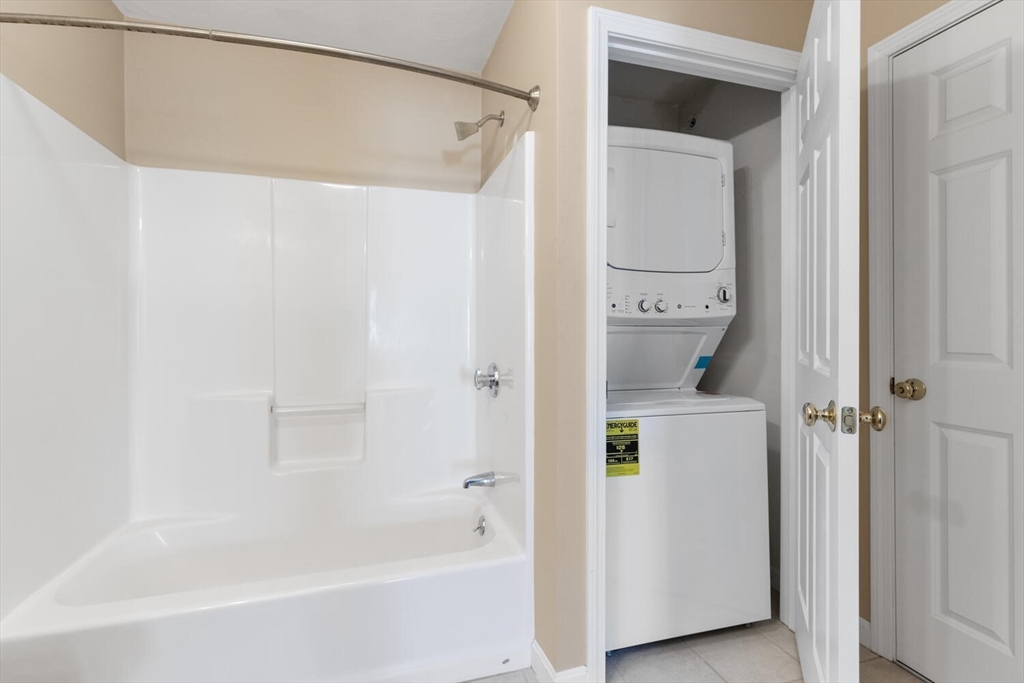18 Dale Street, Unit 9D Andover, MA 01810 - Photo 29 of 33 a bathroom with a bathtub and a shower