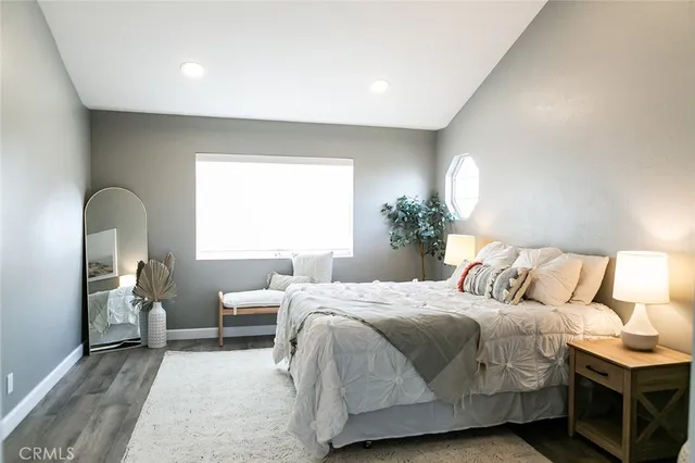 a bedroom with a bed and window