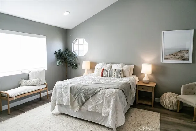 a bedroom with a bed and window