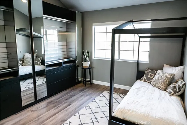 a bed room with a bed and a window