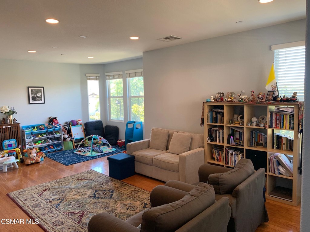 108 Via Katrina Newbury Park, CA 91320 - Photo 2 of 13 a living room with furniture and a book shelf