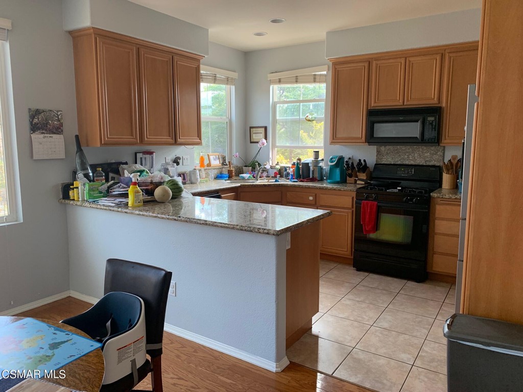 108 Via Katrina Newbury Park, CA 91320 - Photo 4 of 13 a kitchen with stainless steel appliances granite countertop a sink counter space and cabinets